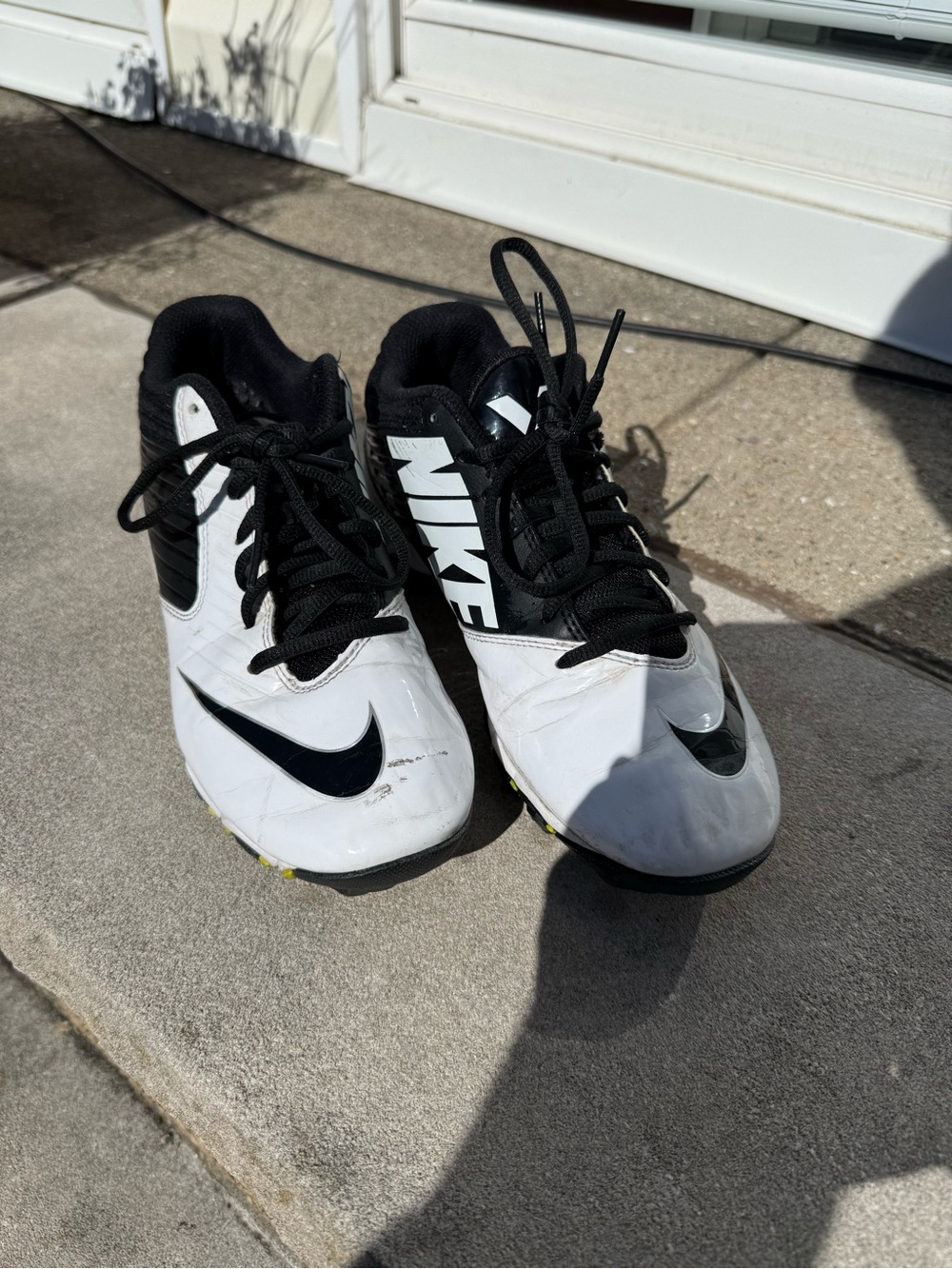 Nike White & Black Athletic Cleats with Swoosh Branding